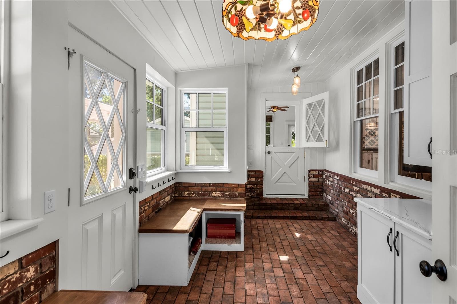 Spacious Mudroom provides entry to carport while a granite countertop, cabinets and a large closet offer both convenience and functionality - 234 N LAKEVIEW AVE, WINTER GARDEN
