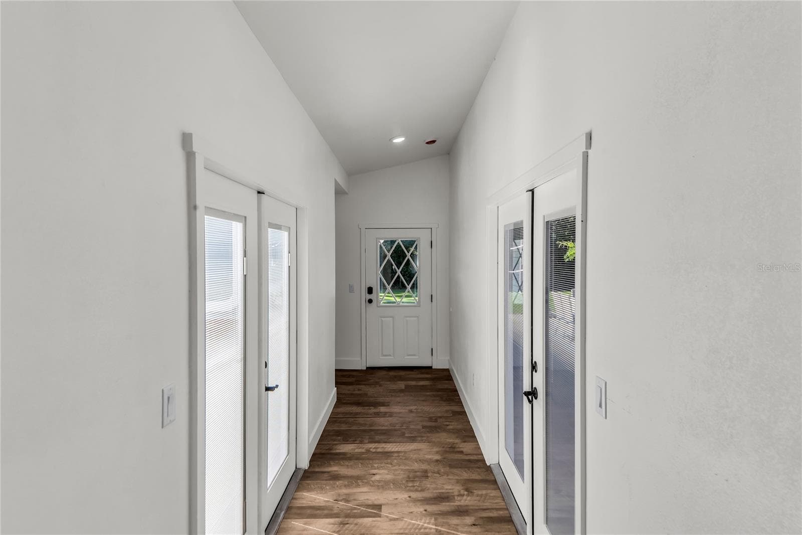 Private hallway leads to newly designed Primary Suite. French Doors lead to pool and backyard on one side and private courtyard on opposite side. - 234 N LAKEVIEW AVE, WINTER GARDEN