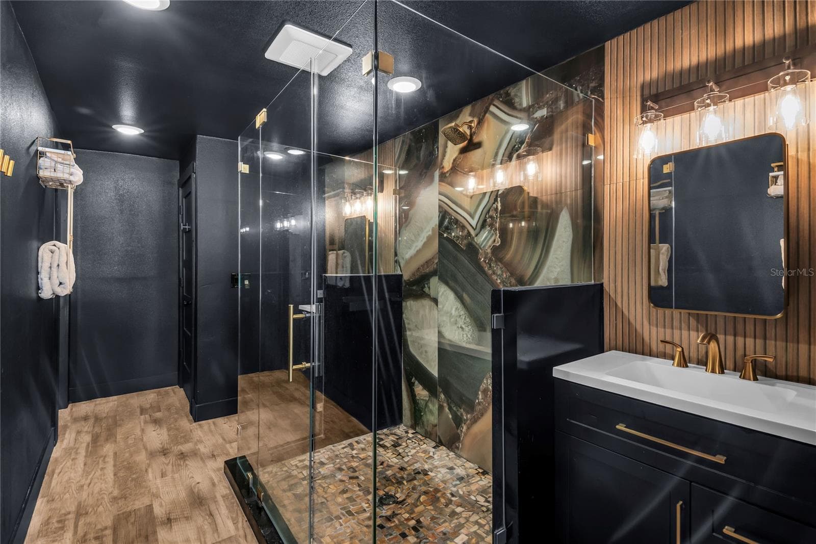 Oversized spa inspired bathroom features with dual vanities, two private water closets, a large glass-enclosed shower and elevated finishes throughout - 234 N LAKEVIEW AVE, WINTER GARDEN