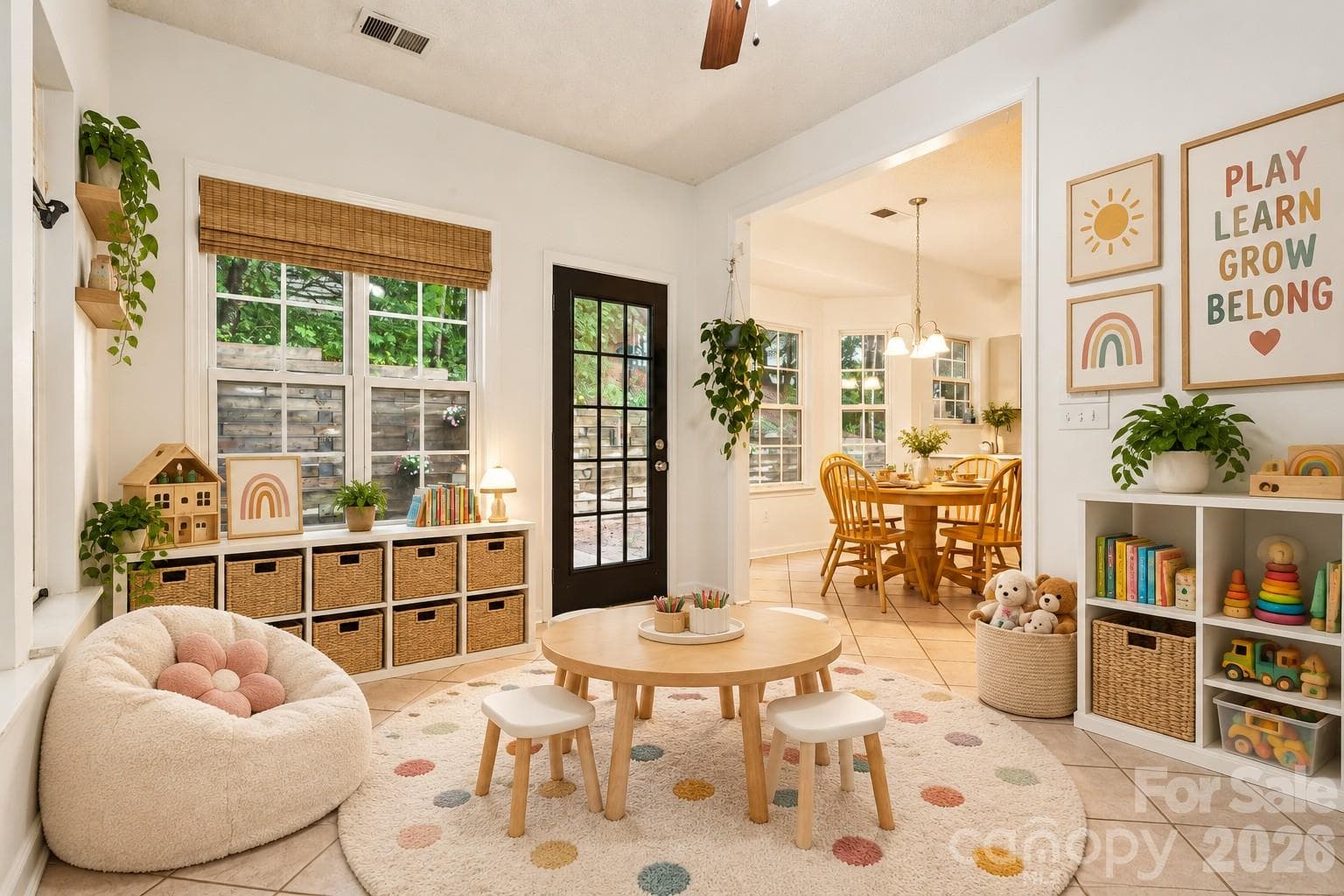 sunroom off kitchen virtually staged as a playroom - 5645 Winslow Avenue NW, Concord