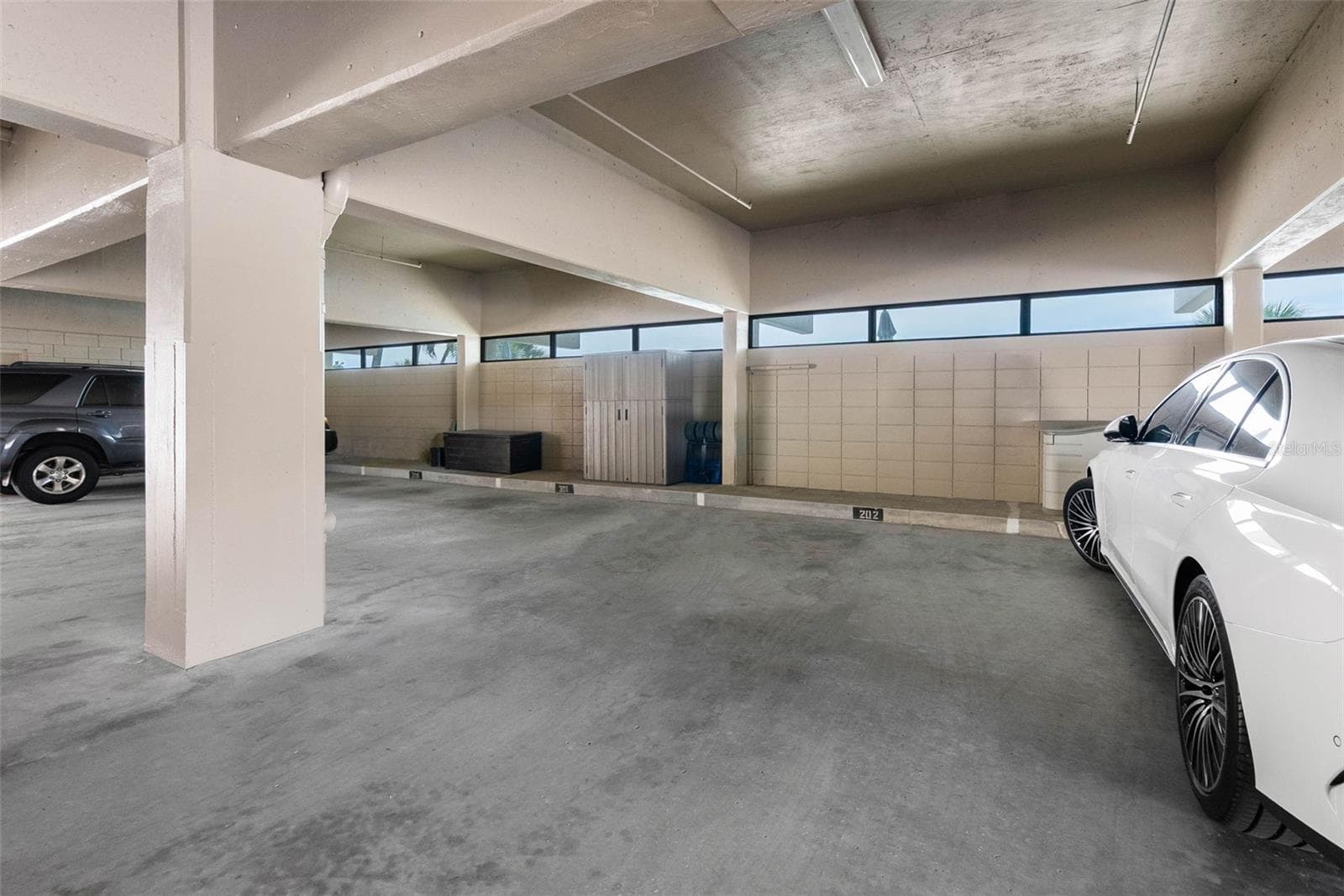 Secure Gated underbuilding garage assigned parking - 19700 GULF BLVD #202, INDIAN SHORES