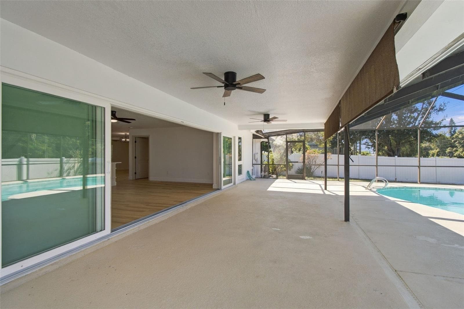 Pool Patio w/ Sliders open - 2942 CLUBHOUSE DR W, CLEARWATER
