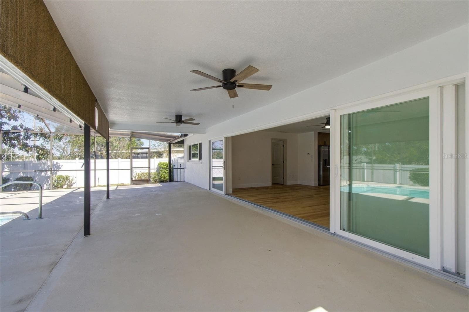 Pool Patio w/ Sliders open - 2942 CLUBHOUSE DR W, CLEARWATER