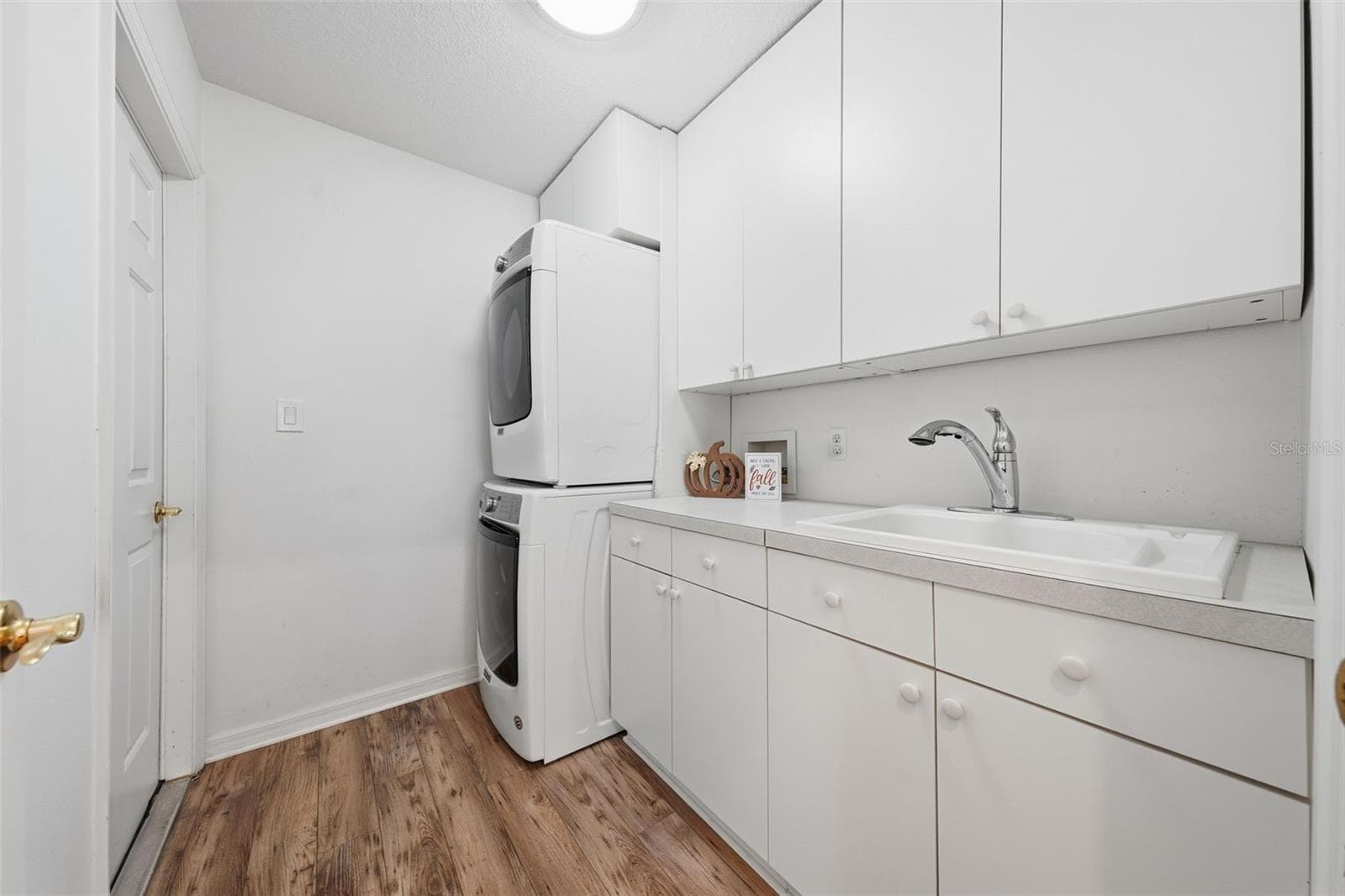 Laundry Room leading out to Garage - With Sink and storage - 24809 RIVERBOAT BND, LEESBURG