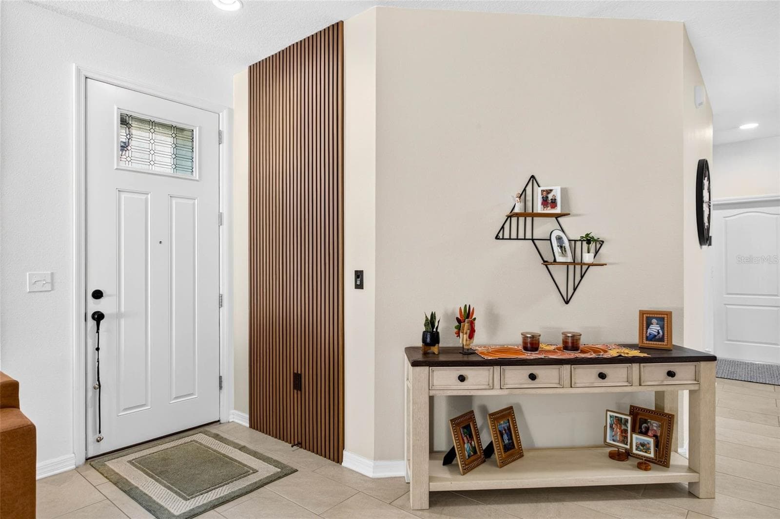 Entryway has paneling accent wall welcoming you home! - 32835 WOODTHRUSH WAY, WESLEY CHAPEL