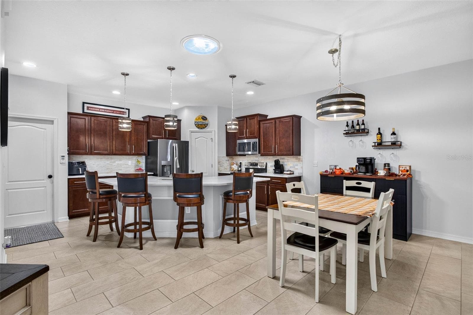 Dining area + kitchen - 32835 WOODTHRUSH WAY, WESLEY CHAPEL