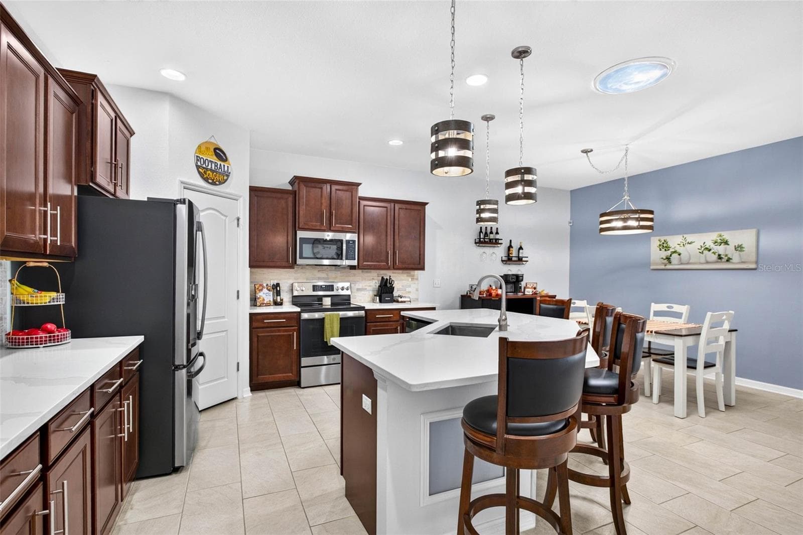 Overhead lighting + a skylight for natural light. - 32835 WOODTHRUSH WAY, WESLEY CHAPEL