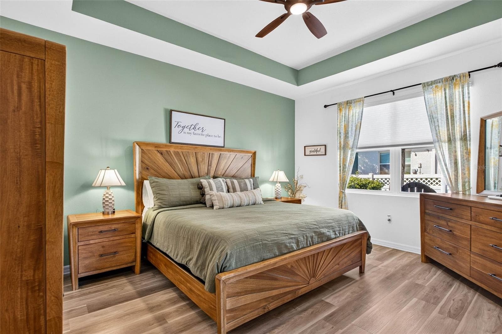 LVP flooring & tray ceiling bring an accent to this room. - 32835 WOODTHRUSH WAY, WESLEY CHAPEL