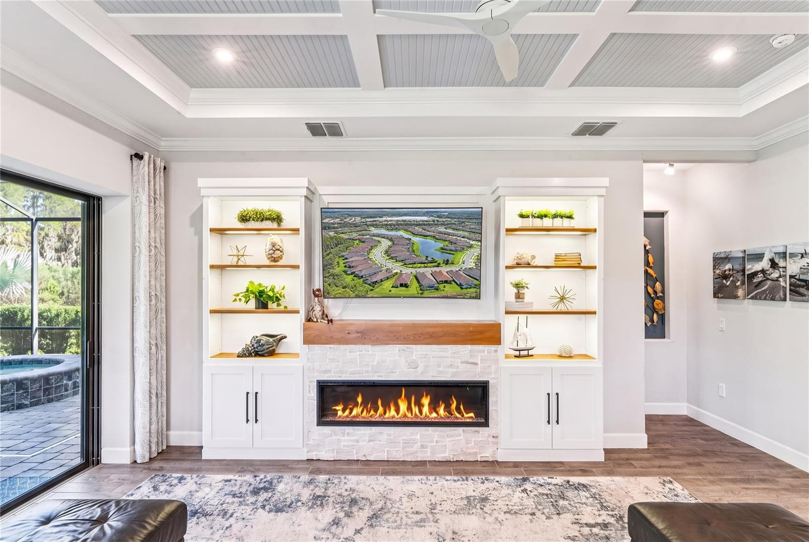 Custom built TV wall with stone, wood shelves, and Fireplace - 10813 CALLUNA DR, ODESSA