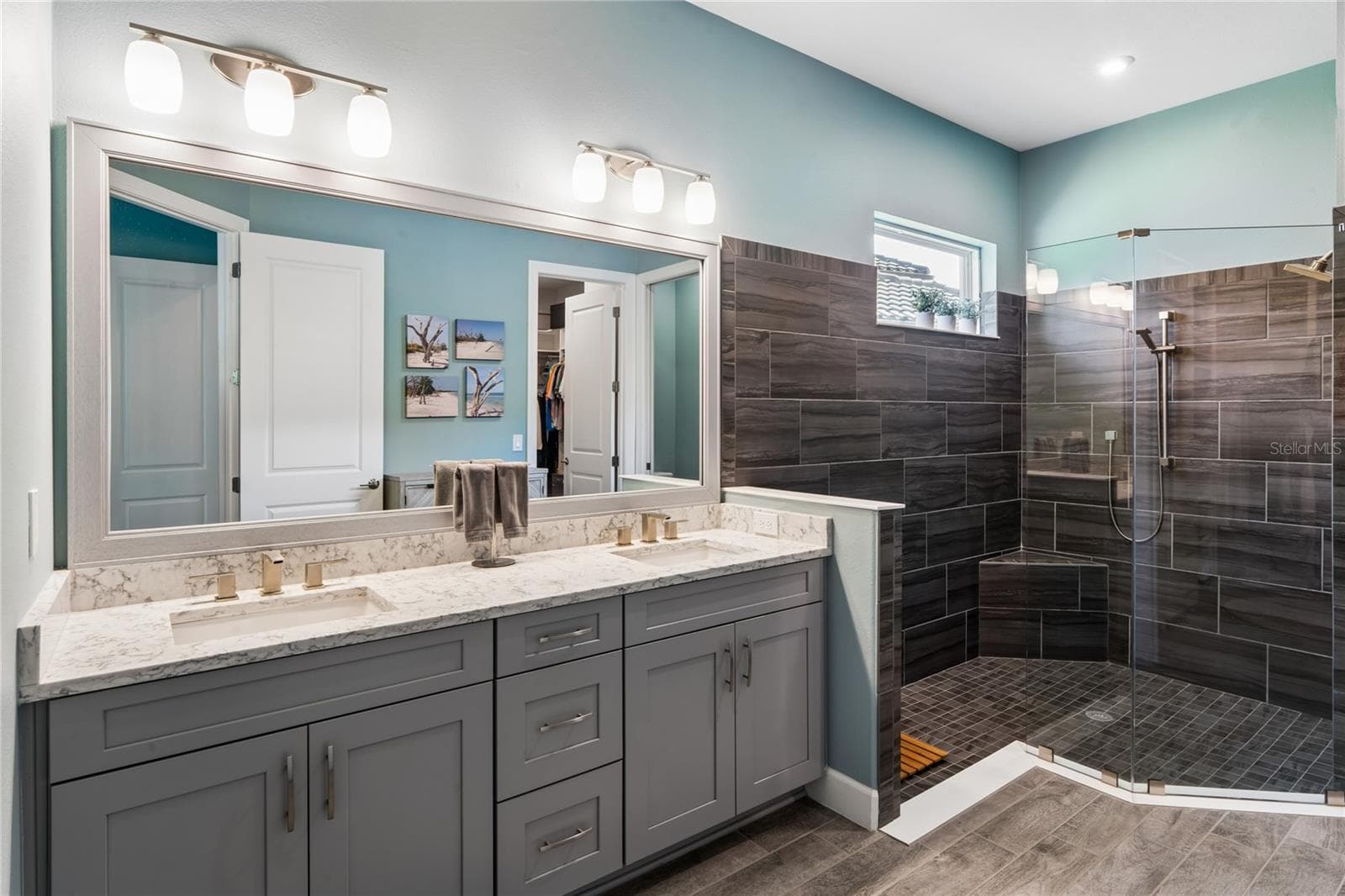 Primary Bath walk-in shower with Dual shower heads and double vanity sinks - 10813 CALLUNA DR, ODESSA