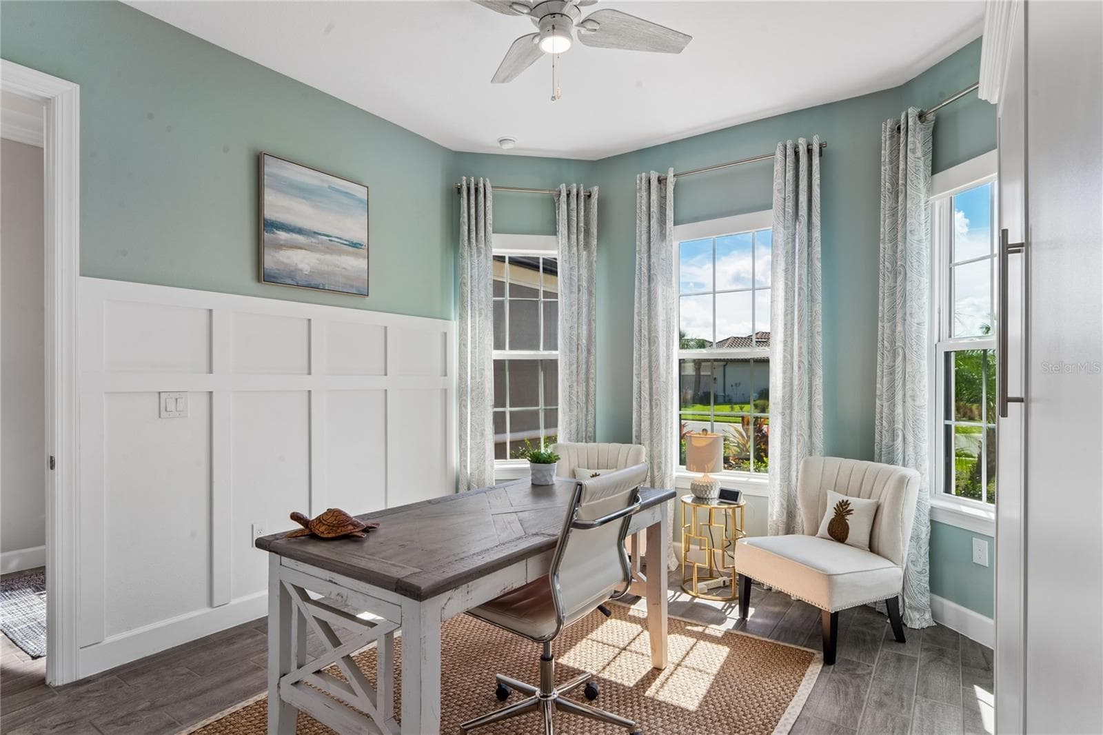 Bedroom 2- wainscoting on wall and bay window - 10813 CALLUNA DR, ODESSA