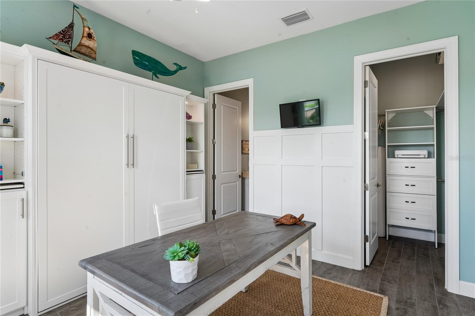 Bedroom 2- built-in Murphy bed with custom shelving and storage - 10813 CALLUNA DR, ODESSA