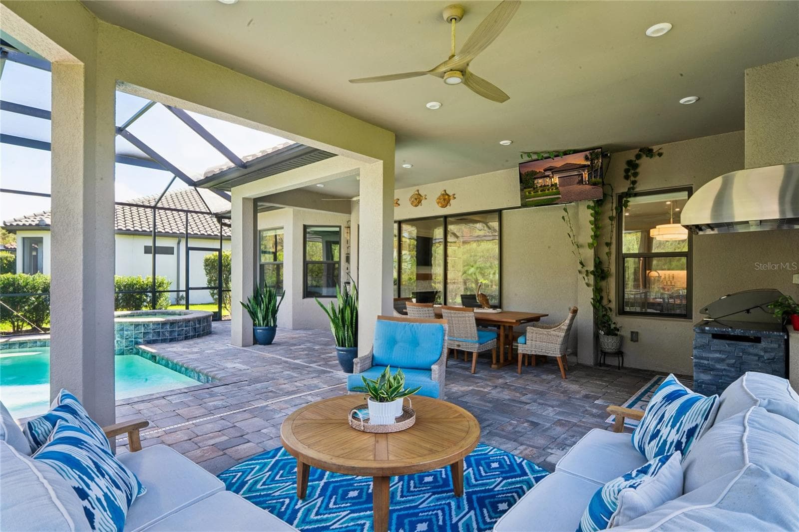 Outdoor Living space w/ Pool lanai, outdoor kitchen & dining - 10813 CALLUNA DR, ODESSA