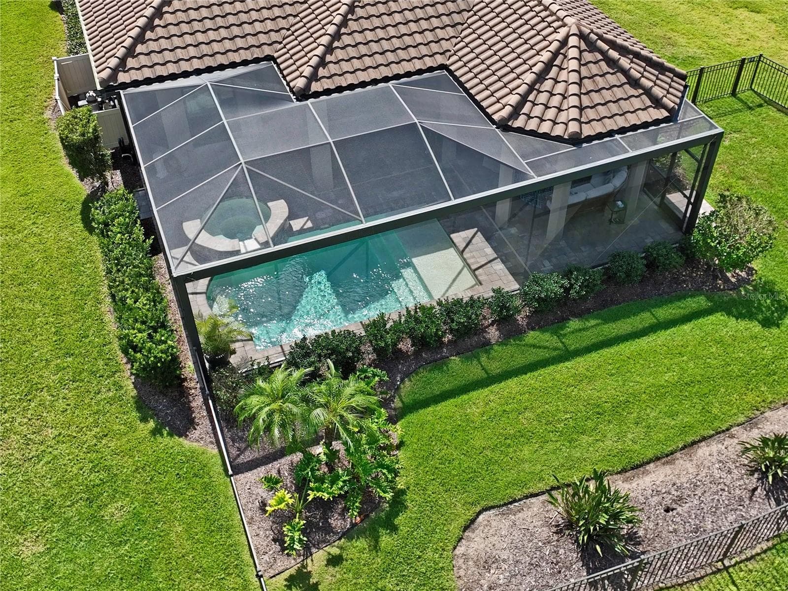 Drone view of backyard, Saltwater Pool & Spa w/ screen enclosure - 10813 CALLUNA DR, ODESSA