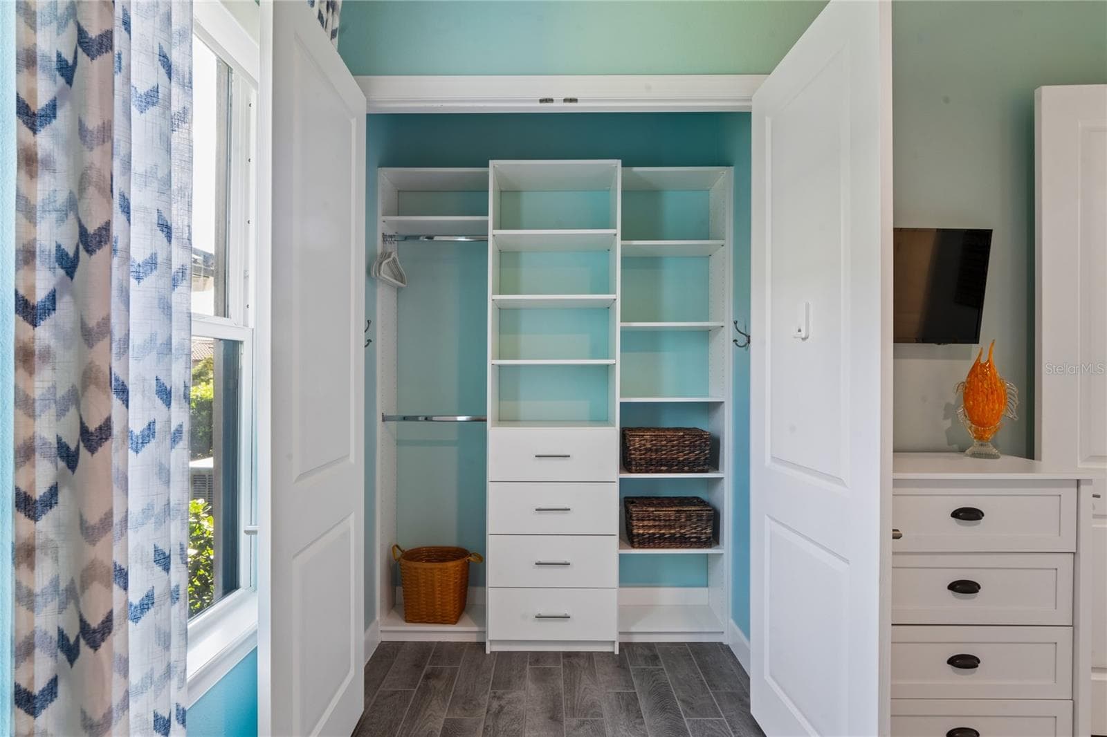 Bedroom 3 storage closet with built-ins - 10813 CALLUNA DR, ODESSA