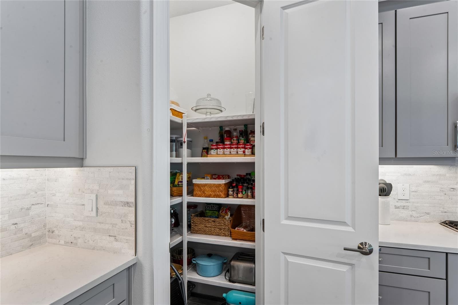 Custom built-in wood shelf pantry - 10813 CALLUNA DR, ODESSA