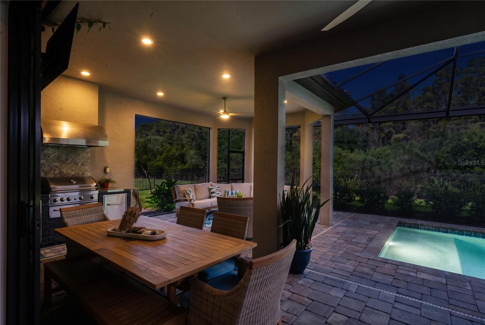 Evening view of outdoor living space - 10813 CALLUNA DR, ODESSA