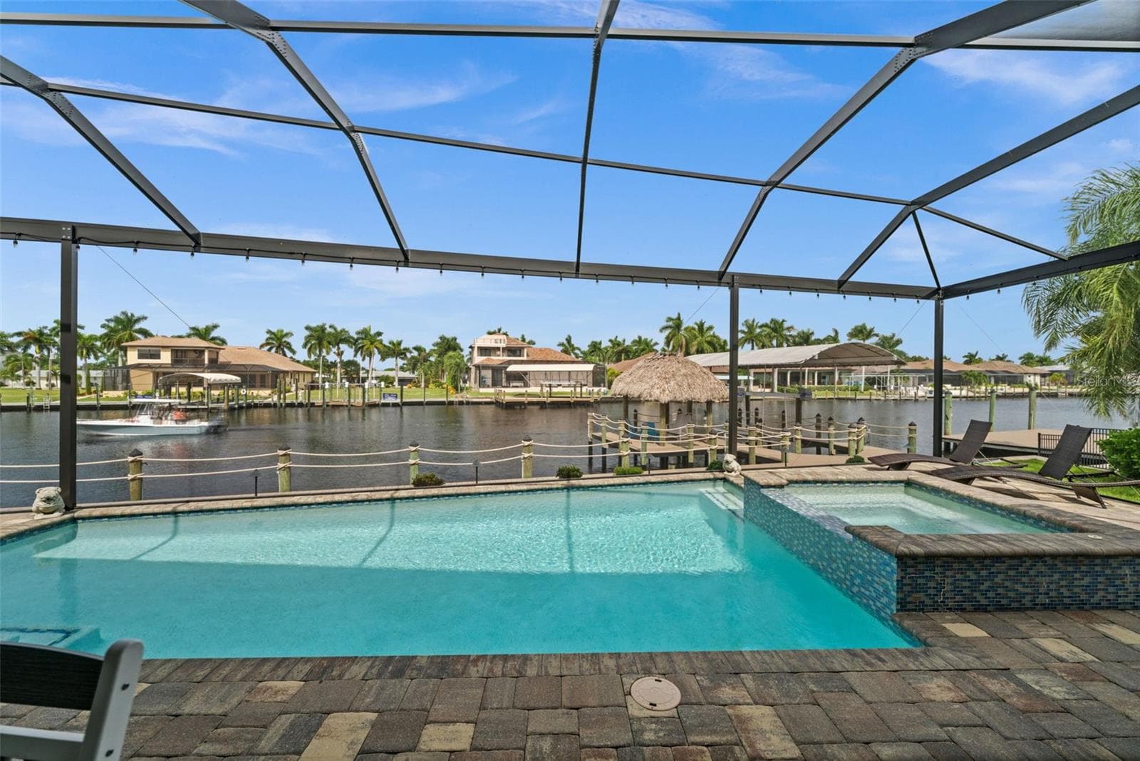 Stunning views over the 200' wide Bimini Canal - 5205 SUNSET CT, CAPE CORAL