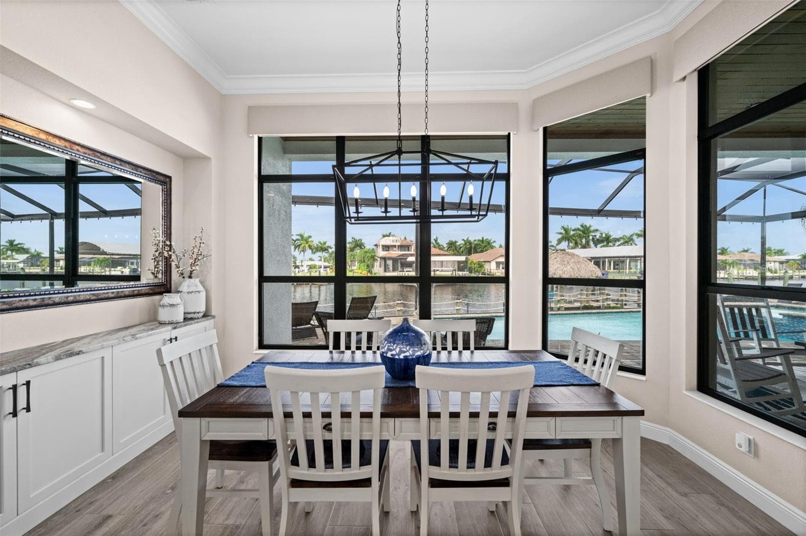 Dining with a view of the water - 5205 SUNSET CT, CAPE CORAL