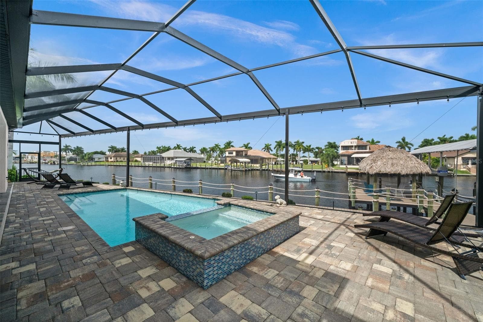Take a dip in the spa while you watch for dolphins - 5205 SUNSET CT, CAPE CORAL