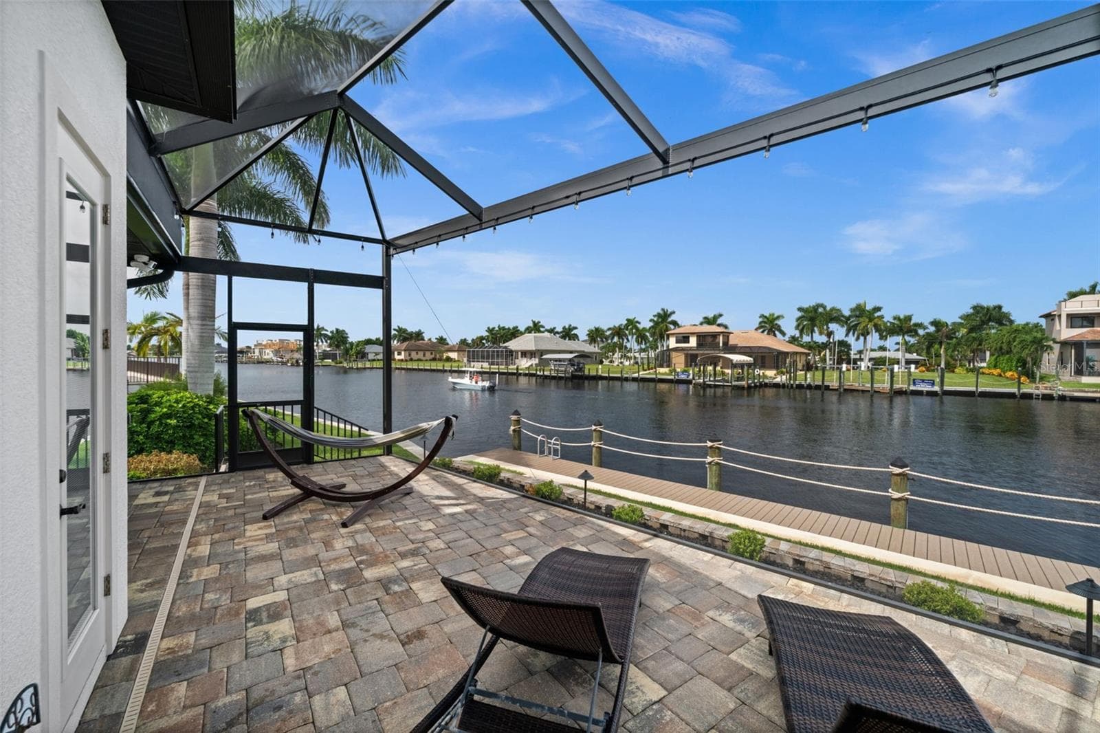Lots of seating area on the screened patio - 5205 SUNSET CT, CAPE CORAL