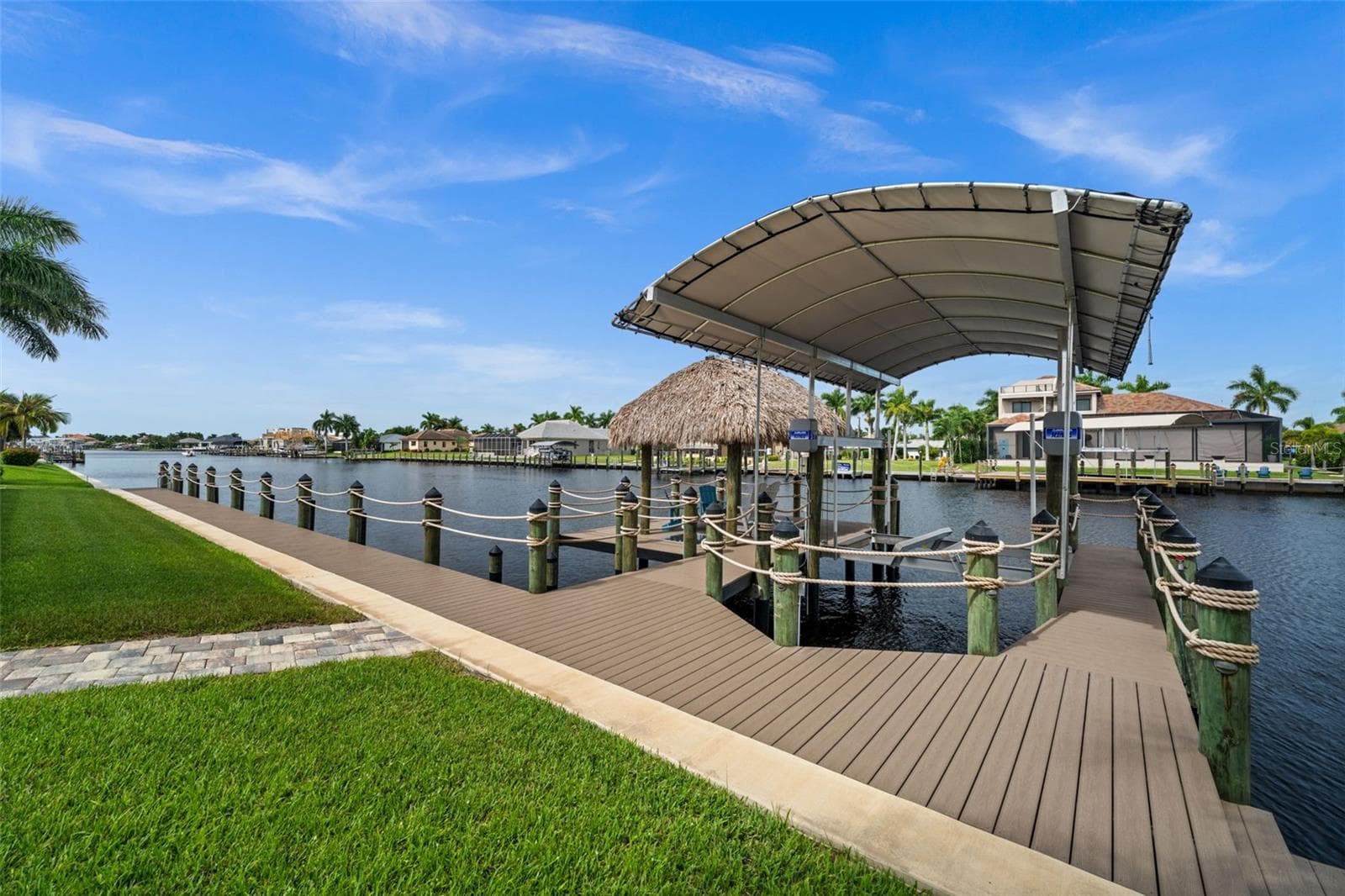 Be ready for boating adventures from your 13,000 pound covered tiki - 5205 SUNSET CT, CAPE CORAL
