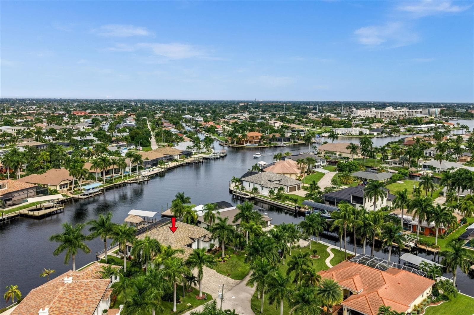 Aerial view of the house and canal - 5205 SUNSET CT, CAPE CORAL