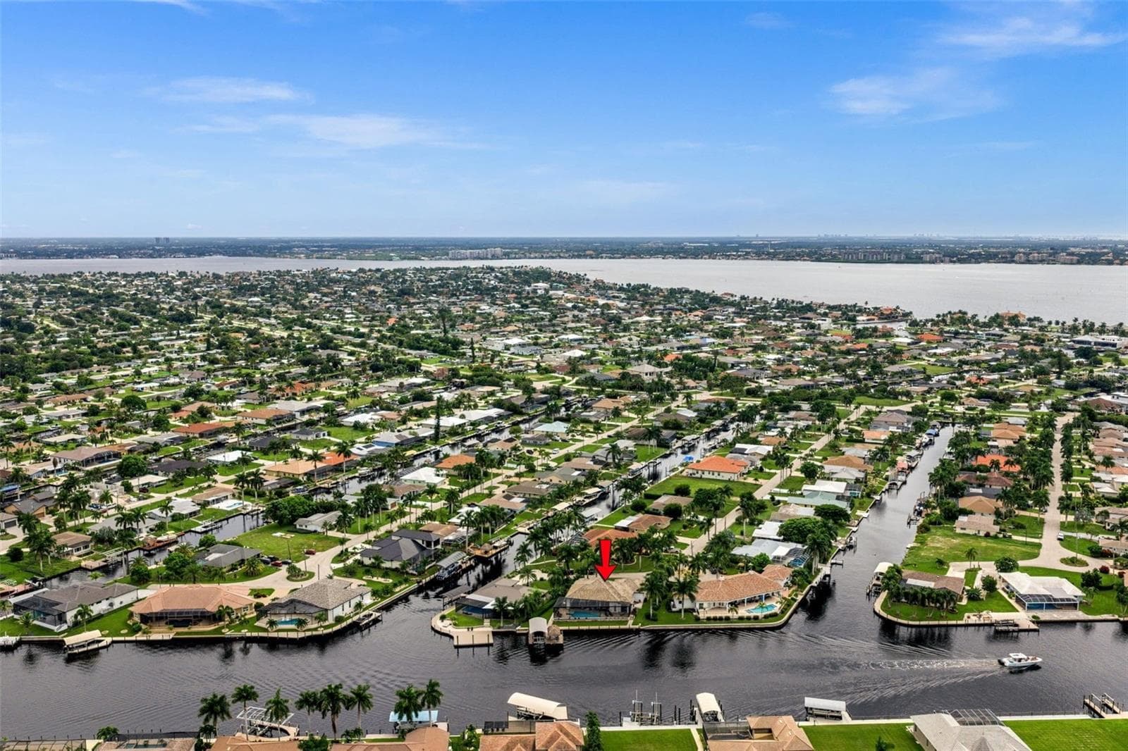 Aerial view of the house, Bimini Canal and Caloosahatchee River - 5205 SUNSET CT, CAPE CORAL