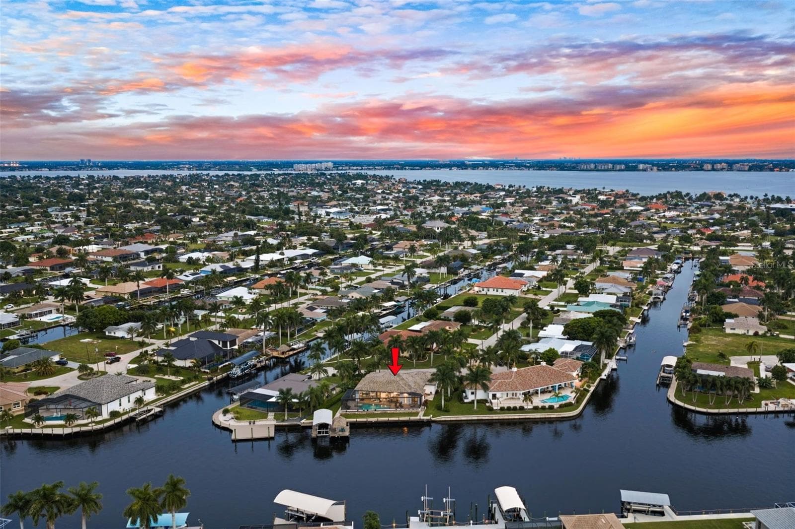 Aerial Evening View - 5205 SUNSET CT, CAPE CORAL