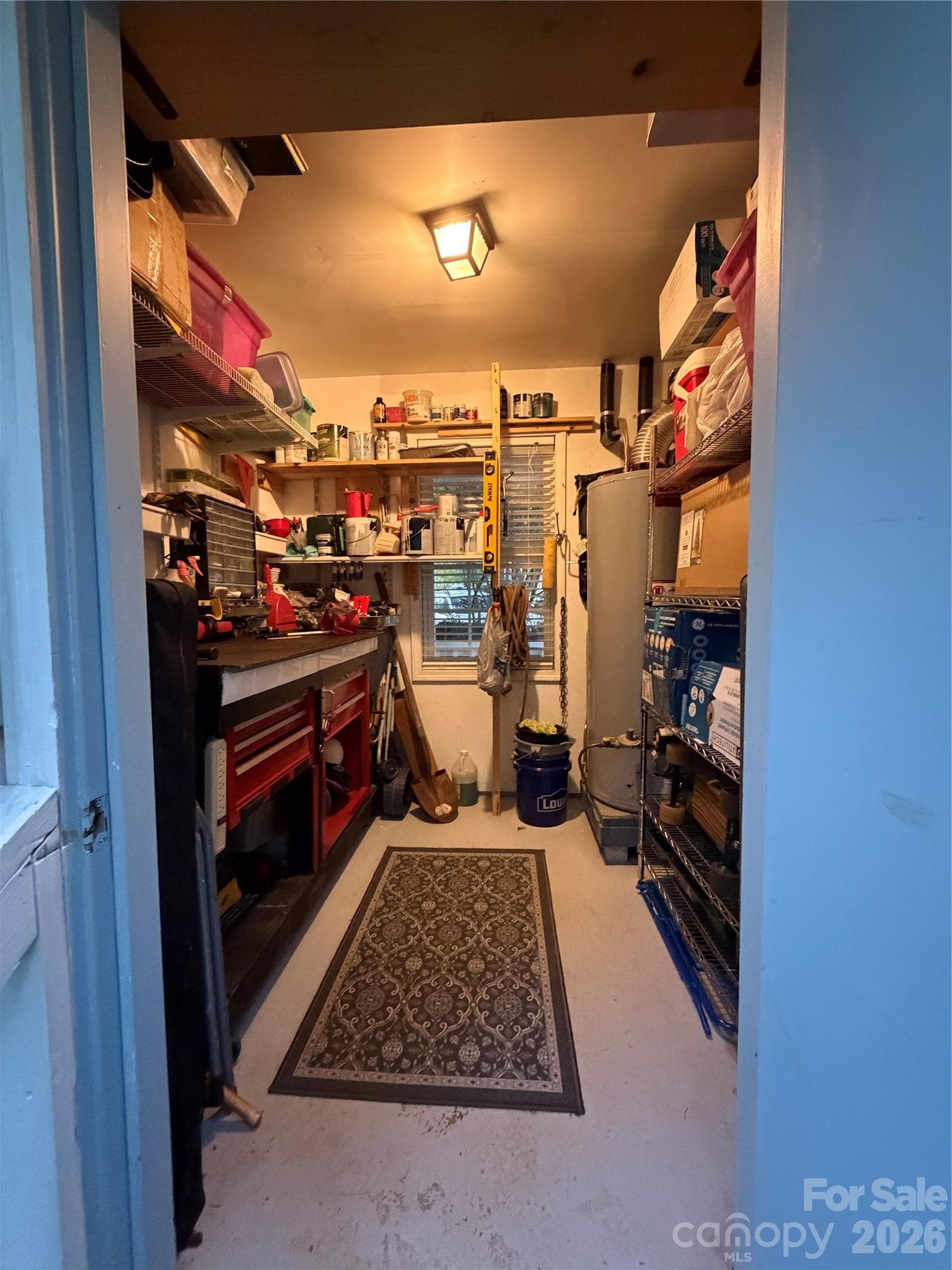 Storage room on back of house. Shelving and Window. - 4126 Medford Drive NW, Concord
