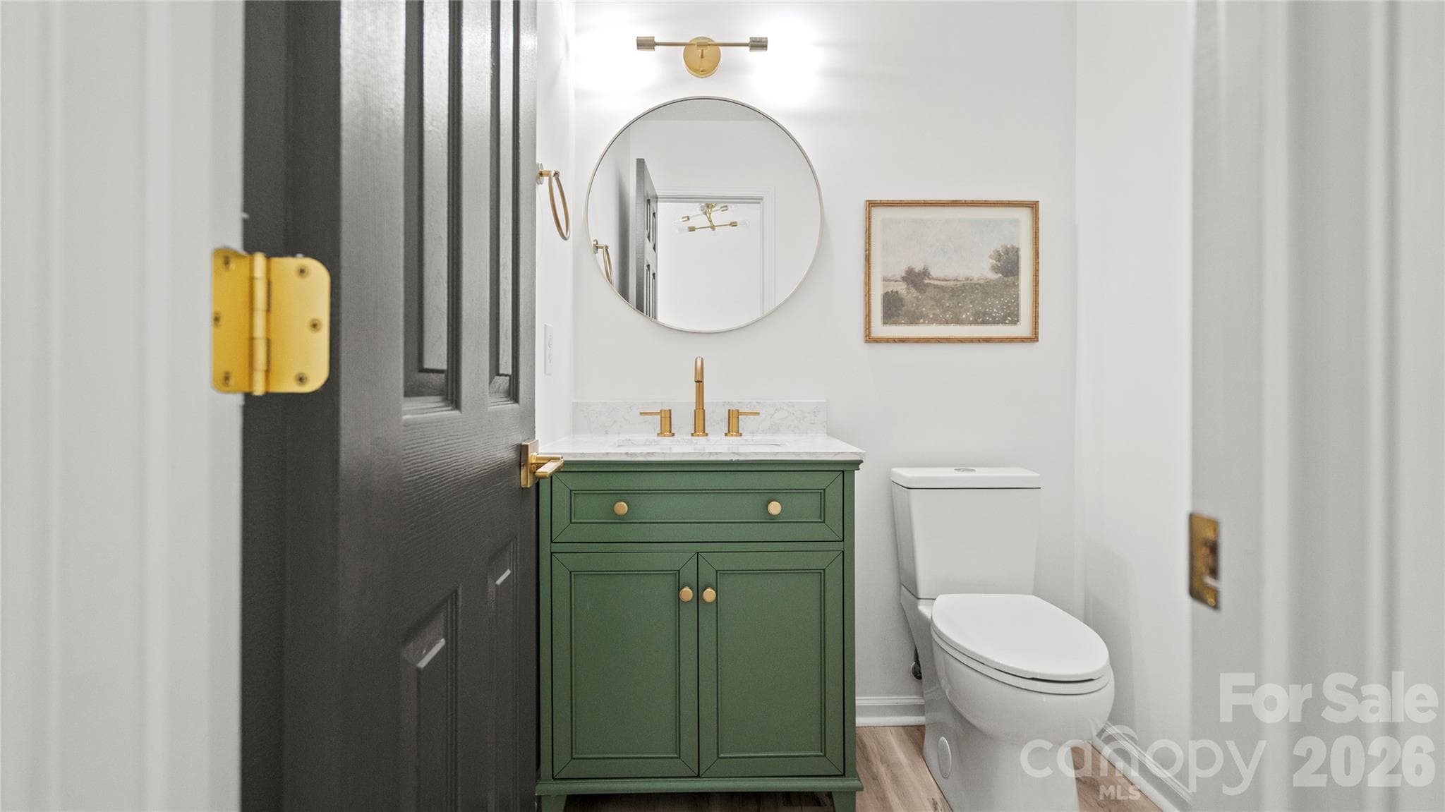 Renovated Half Bath on Main - New Vanity, Mirror, Fixtures, and Commode - 13918 Wild Heather Court, Charlotte