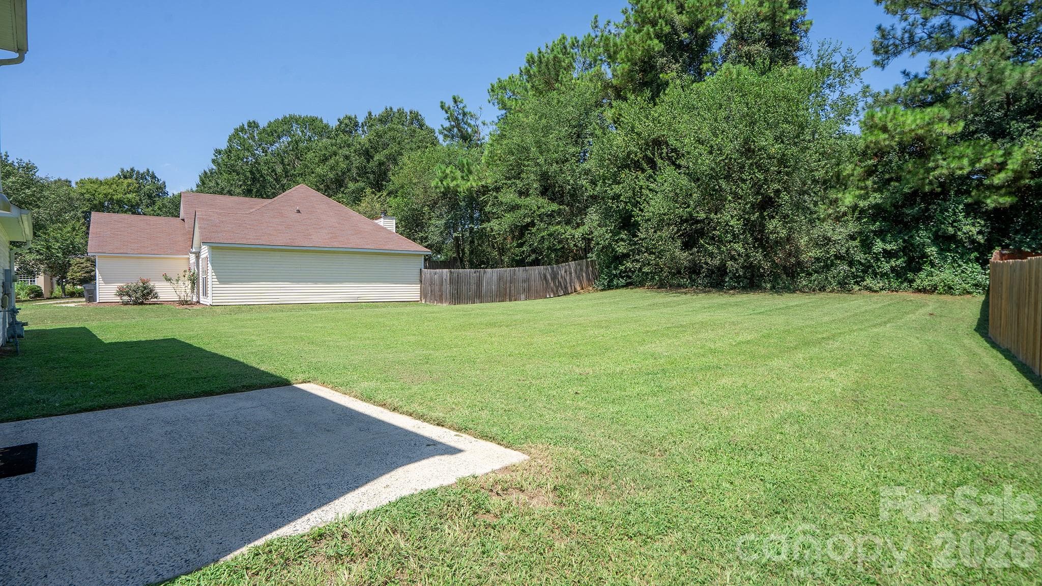 Relaxing Rear Patio Overlooking Tree Lined Backyard - 13918 Wild Heather Court, Charlotte