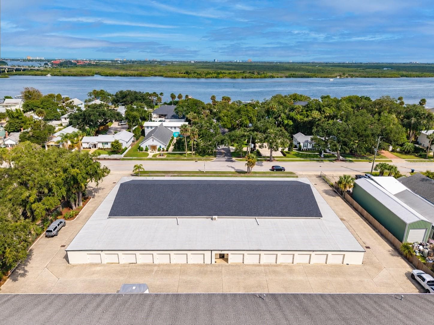 Roll up garage doors along perimeter with additional interior storage spaces on Magnolia building - 720 MAGNOLIA ST, NEW SMYRNA BEACH