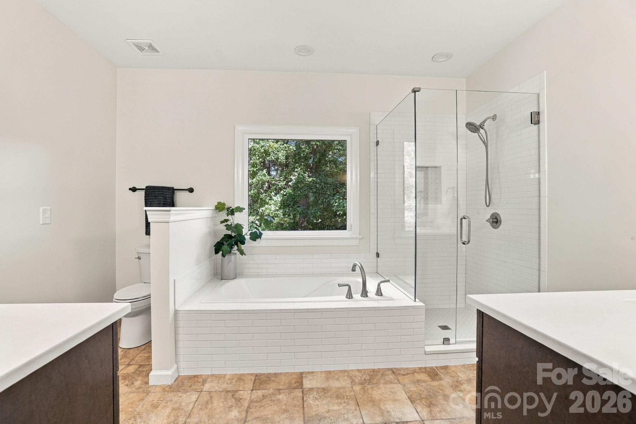 410 Whitefriars Ln Matthews 28105Primary Bathroom with tiled shower and tub surround - 410 Whitefriars Lane, Matthews