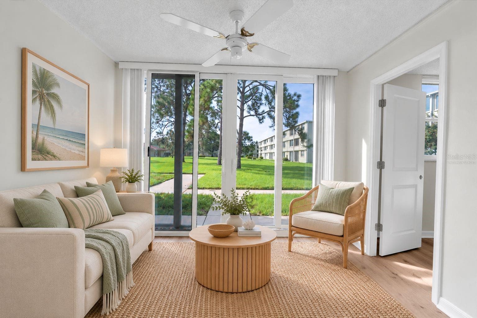 Virtually Staged: Florida Room Looking Towards massive courtyard with Pool. - 4885 1ST ST NE #106, ST PETERSBURG