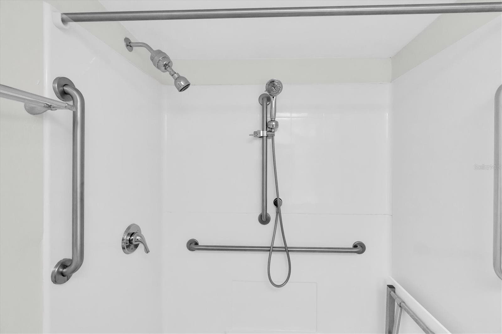Ensuite Step-In Shower with Grab Bars and Seat. - 4885 1ST ST NE #106, ST PETERSBURG