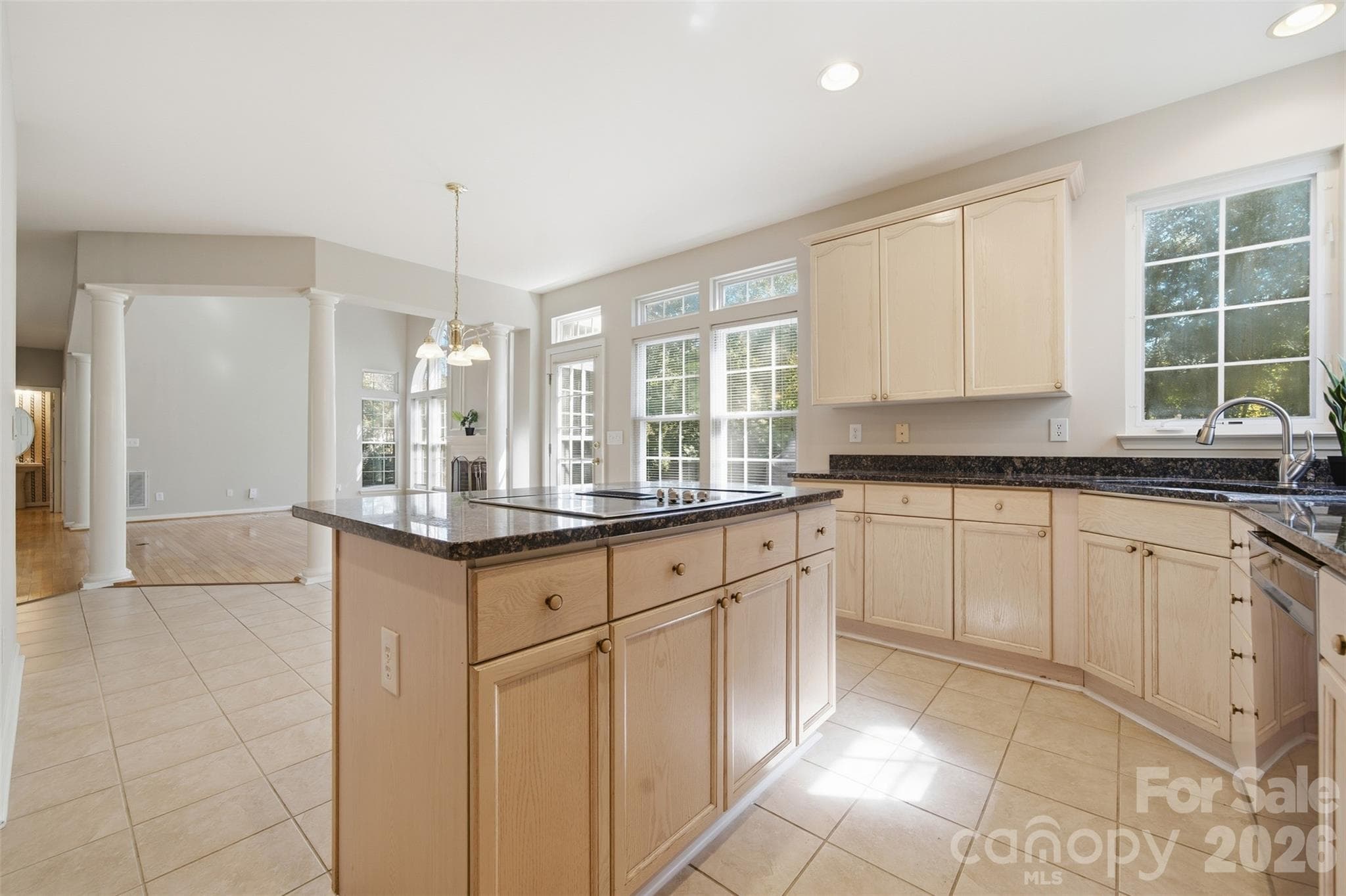 Kitchen with stainless steel appliances, island, and granite countertops - 6211 Chavel Lane, Charlotte
