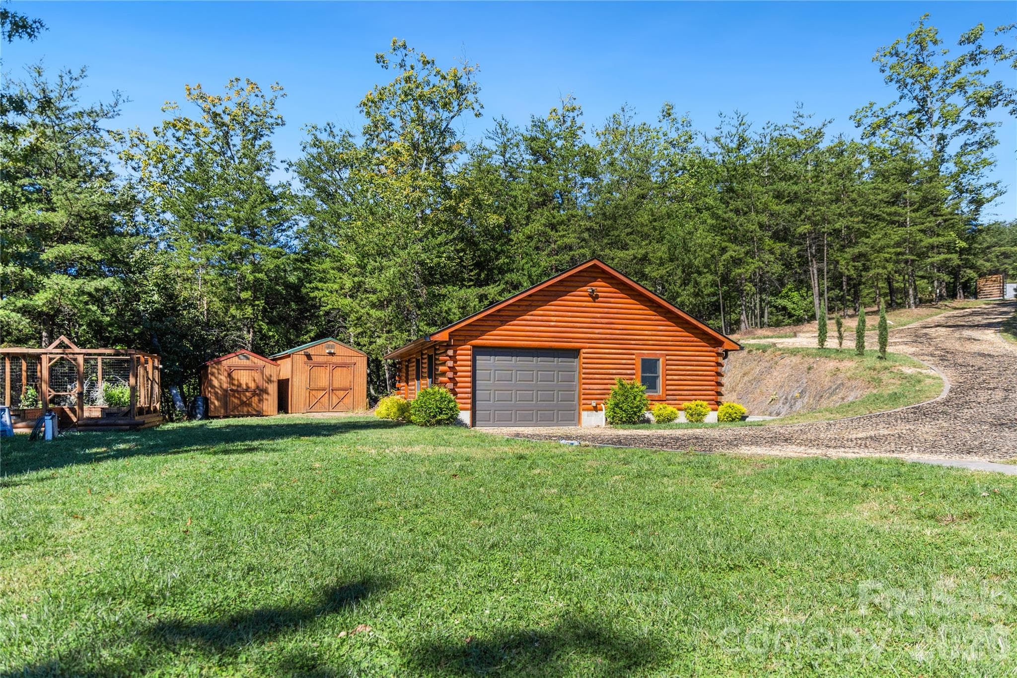 Gated Entry Drive with Gravel Geo-Grid, Oversized Garage, Storage Sheds and Fenced Kitchen Garden - 656 Arbra Mountain Way, Bostic