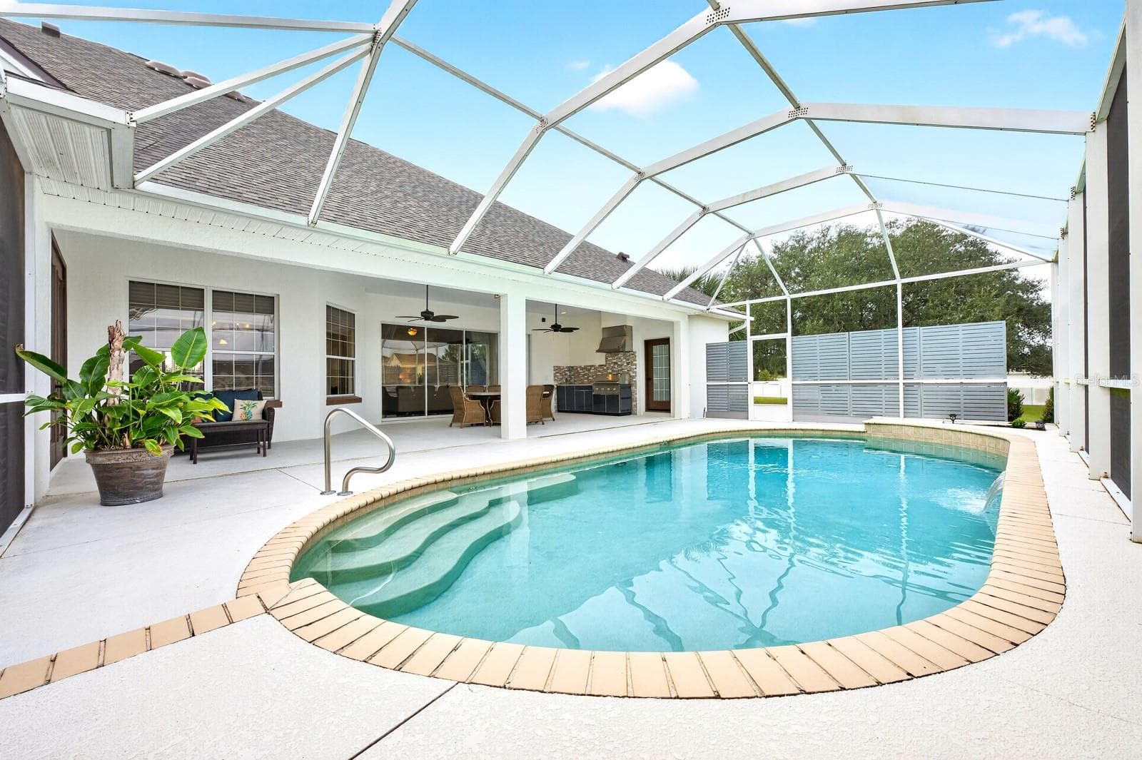 Plus an entertainer's paradise when you step outside the wall of sliding glass doors. - 5092 NE 81ST BLVD, WILDWOOD