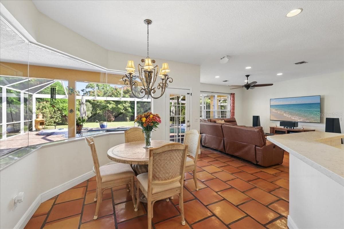 Breakfast room and family room - 25200 HARBORSIDE BLVD, PUNTA GORDA