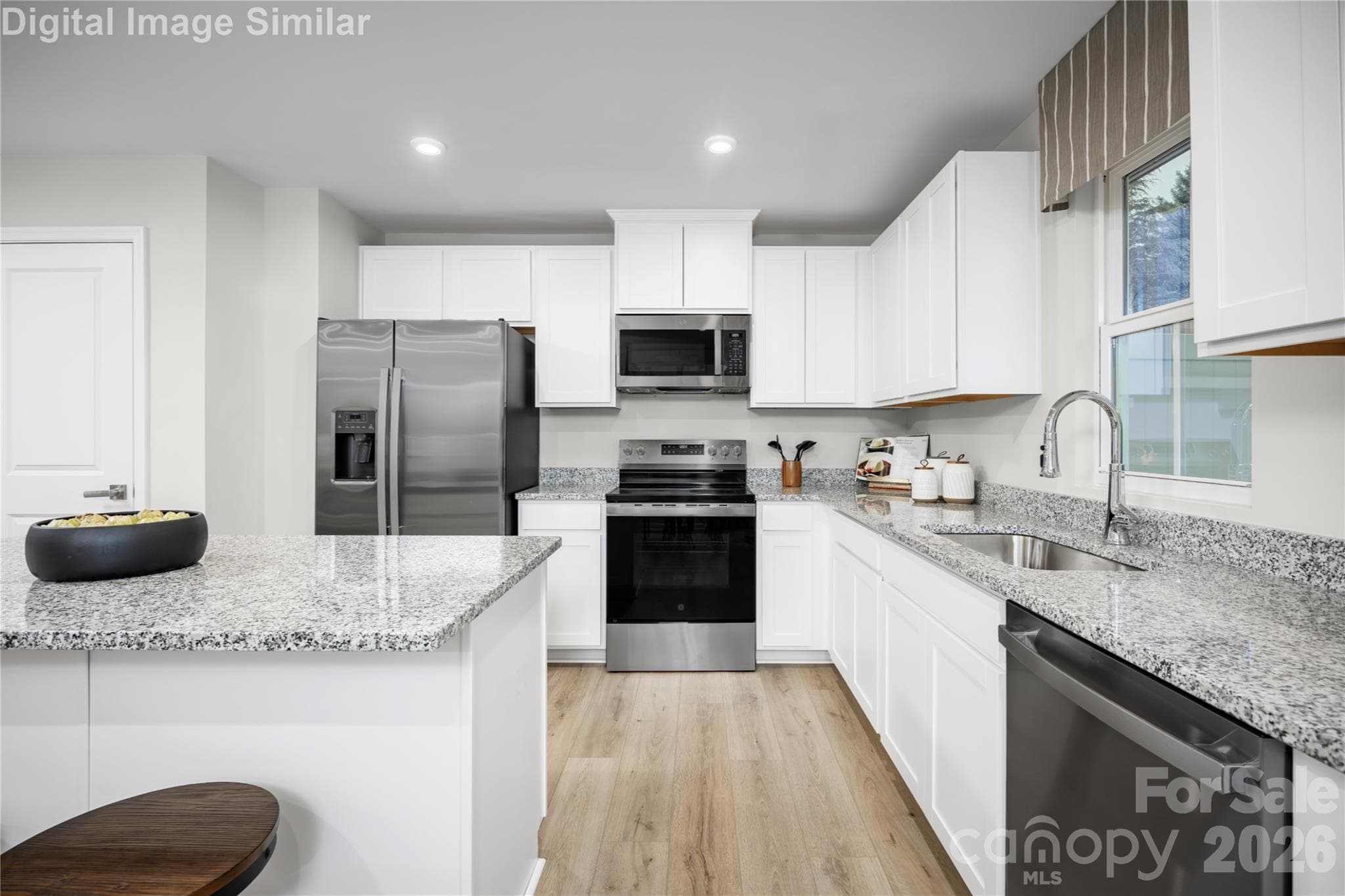 The kitchen that brings it all together—spacious, stylish, and designed for everyday living and unforgettable moments. - 5215 Macvittie Lane, Charlotte