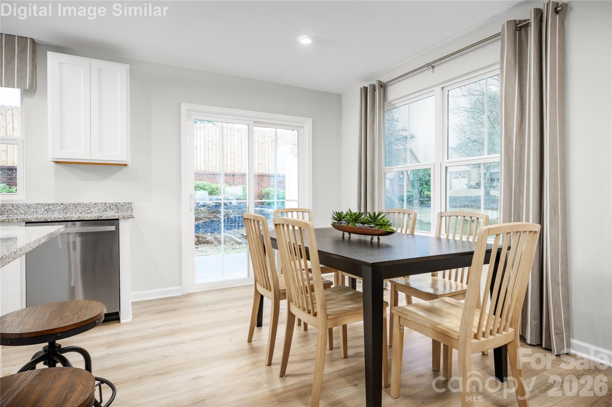 Come together over delicious meals and shared laughter—this dining space is made for moments that matter. - 5215 Macvittie Lane, Charlotte