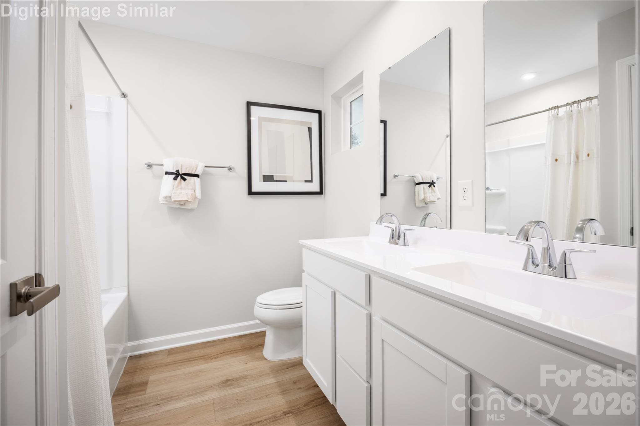 Relax and recharge in this spa-inspired owner’s bath—featuring dual ceramic sinks, generous space, and thoughtful storage for everyday luxury. - 5223 Macvittie Lane, Charlotte