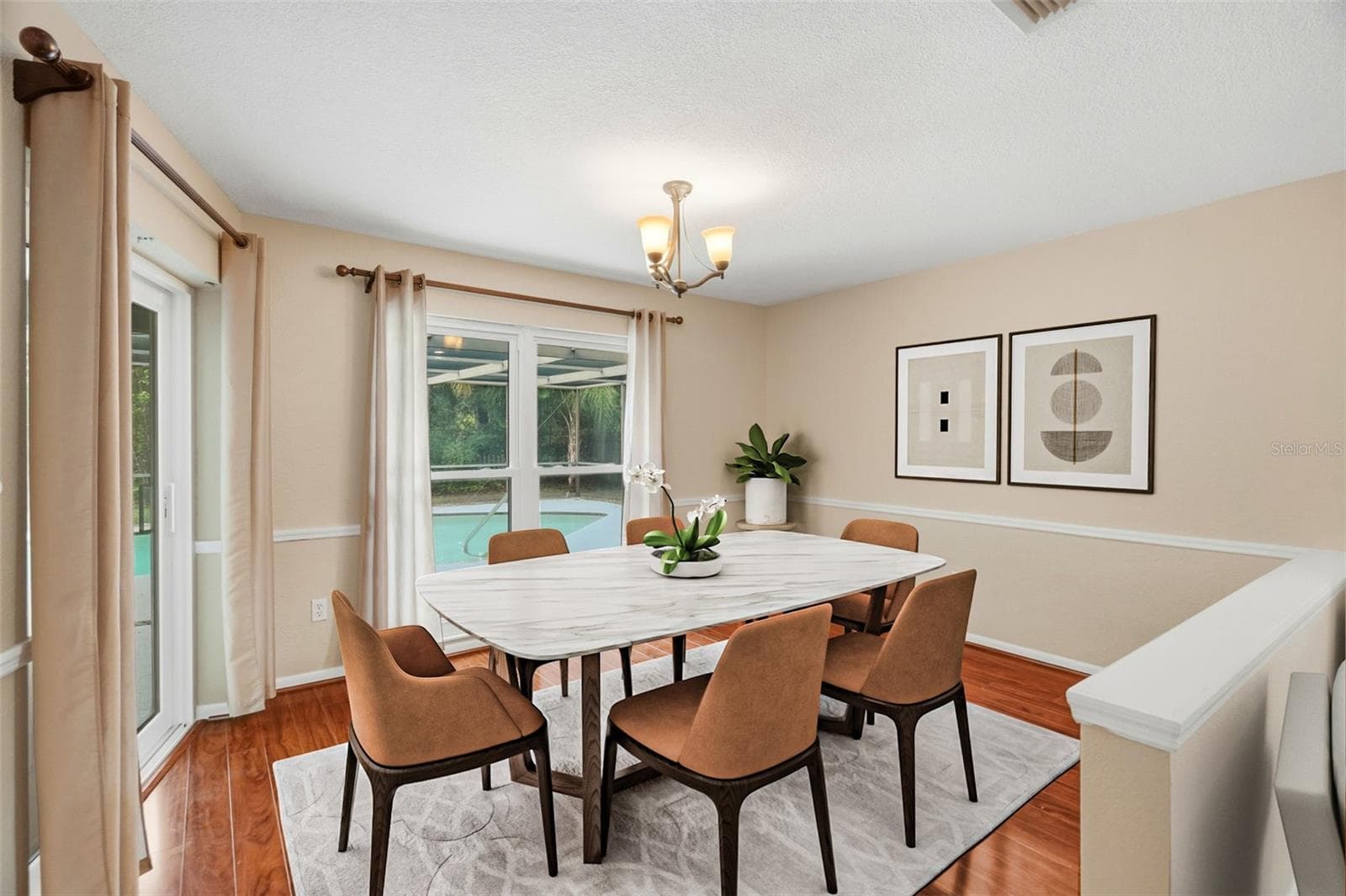 Dining area with pool access. - 1297 PEACH TREE DR, DUNEDIN