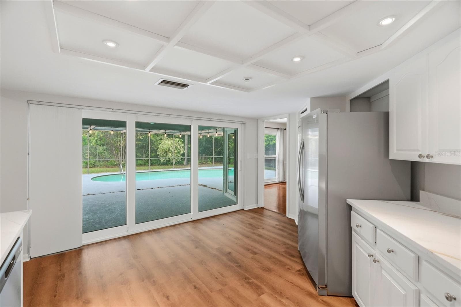 Kitchen with direct access to the pool. - 1297 PEACH TREE DR, DUNEDIN
