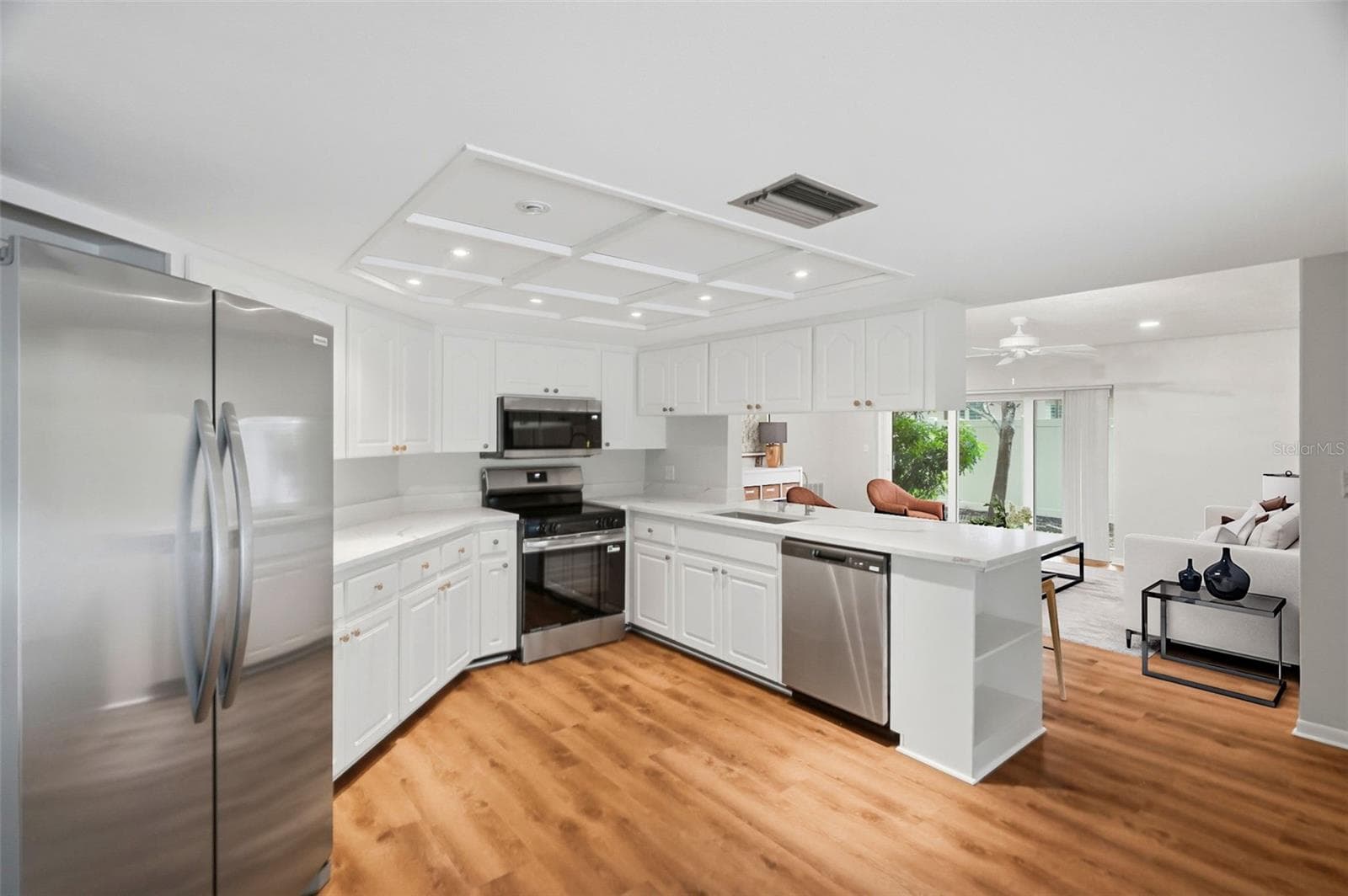 Kitchen and Family room. - 1297 PEACH TREE DR, DUNEDIN