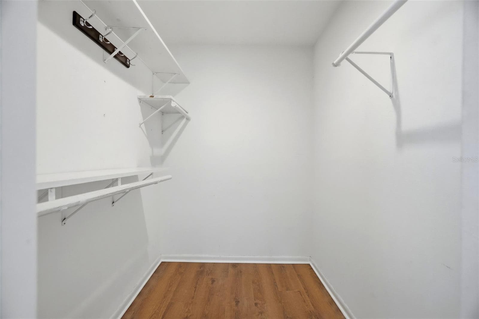 Walk-in closet in the primary bedroom. - 1297 PEACH TREE DR, DUNEDIN