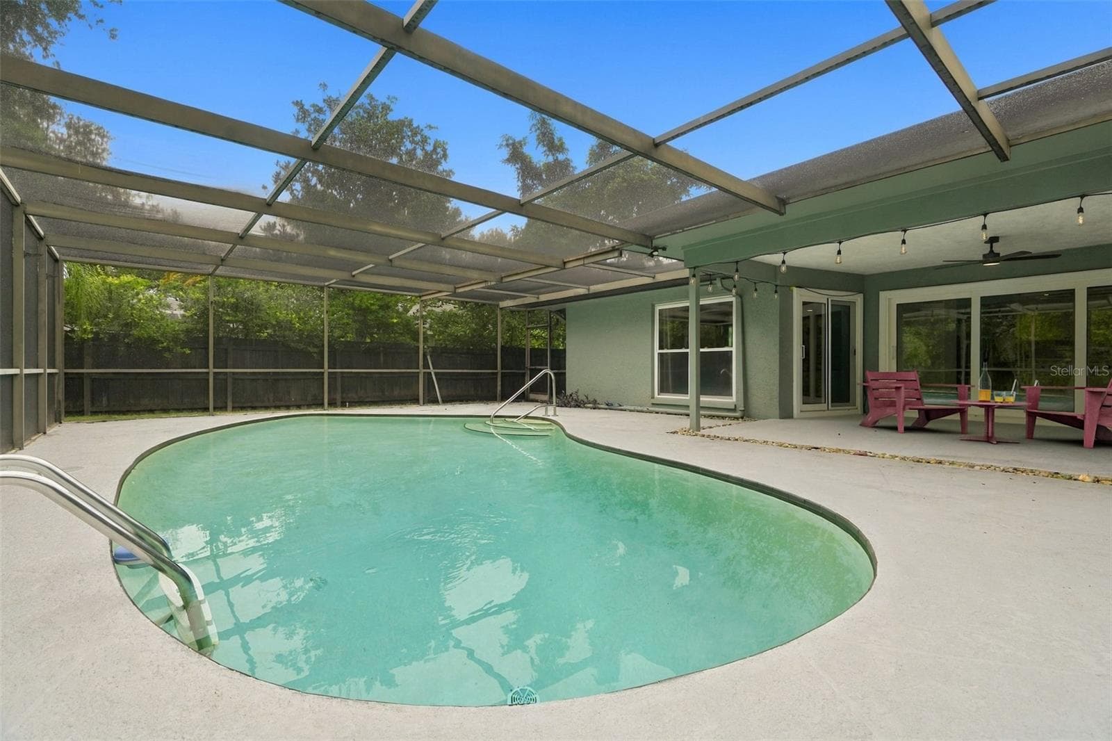 Screened enclosed pool area. - 1297 PEACH TREE DR, DUNEDIN