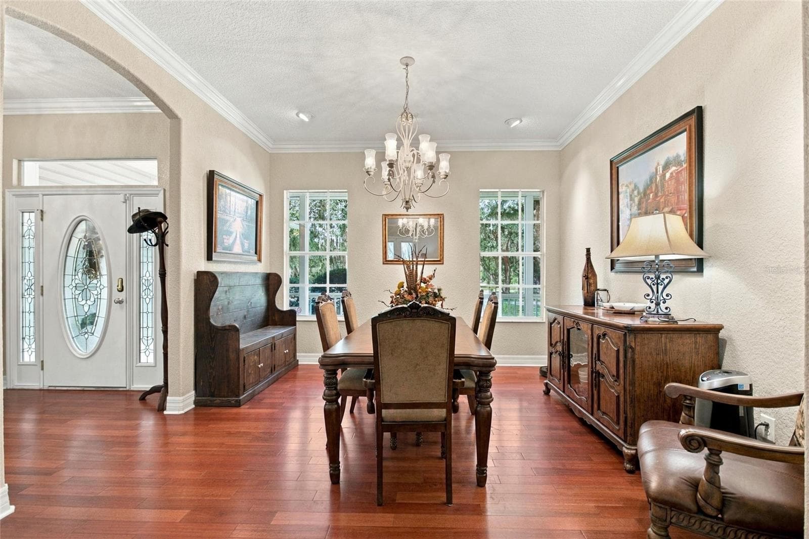 View of front entry and formal dining area from living room. - 4108 N FORBES RD, PLANT CITY