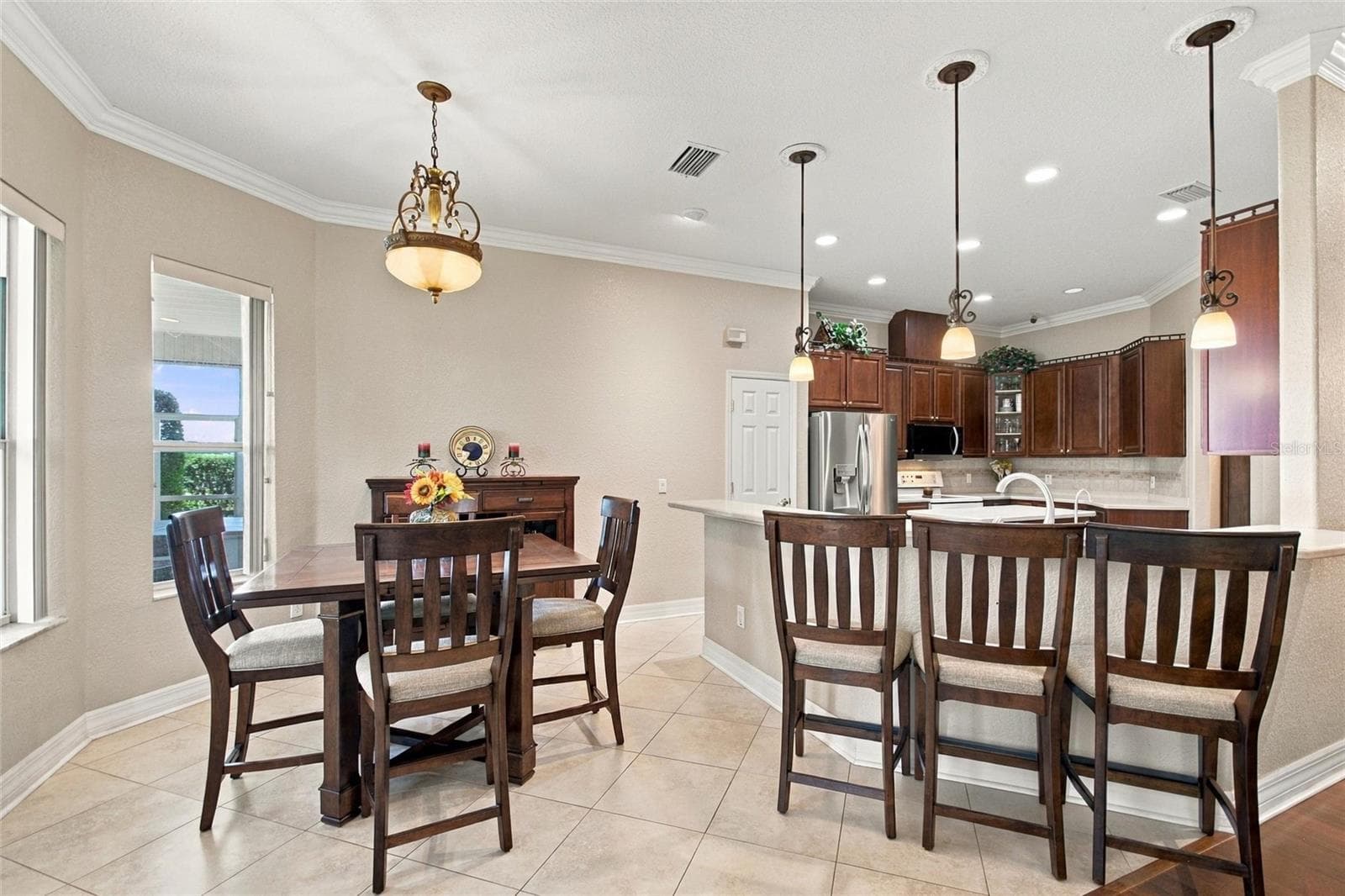 View of dinette and breakfast bar. - 4108 N FORBES RD, PLANT CITY